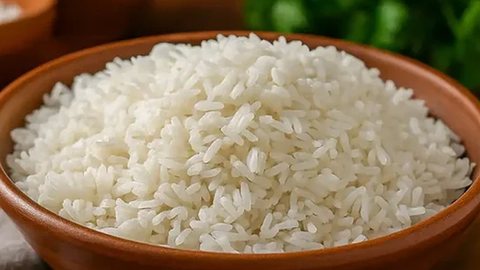 A small silver dish of cooked white rice